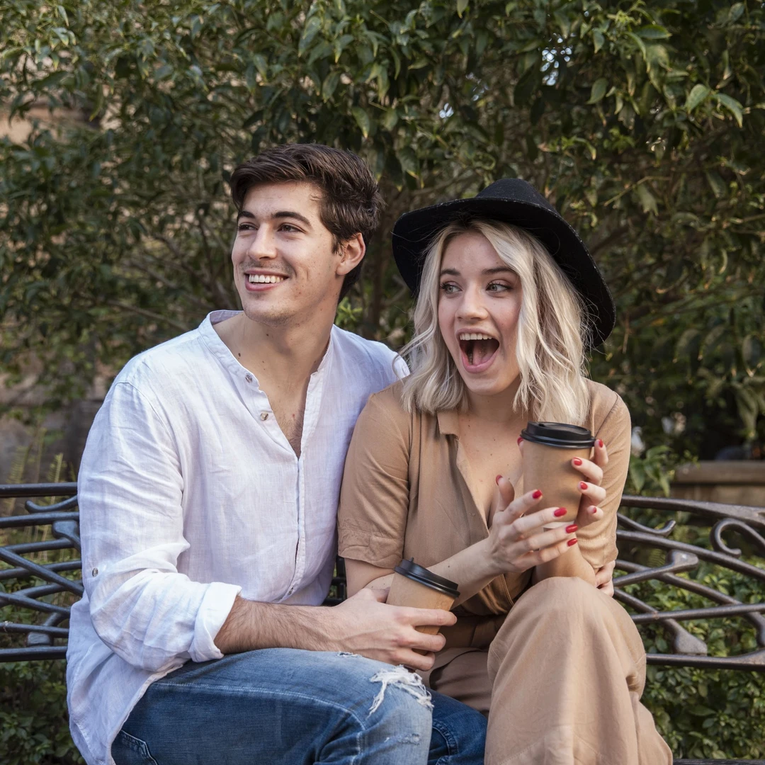 surprised-couple-bench-with-coffee-cup.jpg